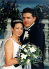 couple_inside_w_bouquet.jpg (47561 bytes)